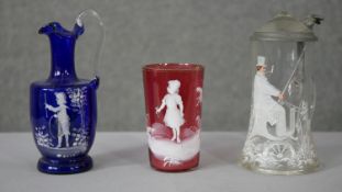 A collection of Victorian Mary Gregory style glassware. Including a cranberry blown glass cup with
