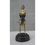 An Art Deco style patinated brass figure of 'The Whip Girl' after Bruno Zach. H.32 W.14 D.12cm