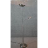 A contemporary brushed chrome standard uplighter fitted with adjustable reading light arm. H.181