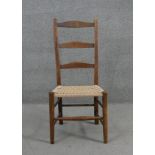 A 19th century Shaker style chair with woven seat.