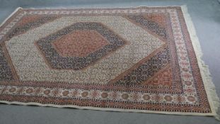 A Bidjar motif carpet with central lozenge medallions in diagonal spandrels and multiple