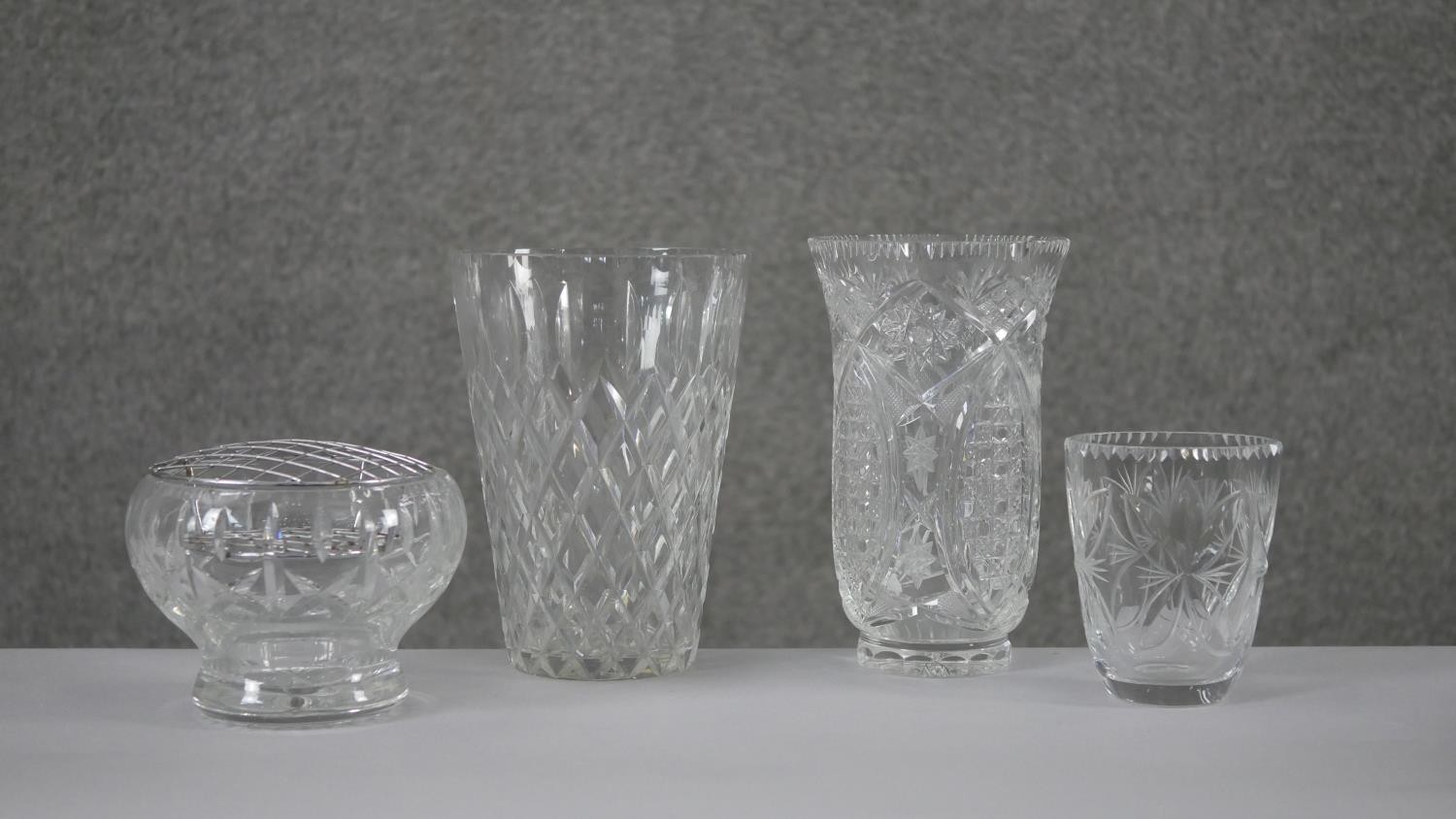 A collection of four cut crystal flower vases with stylised foliate design. H.20 Diam.15cm (largest) - Image 3 of 8