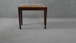 A C.1900 mahogany piano stool with it's original tapestry drop in seat. H.50 W.60 D.35cm.