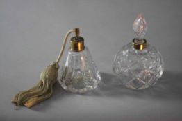 A cut glass perfume bottle with blown glass stopper along with a cut glass atomiser. H.17