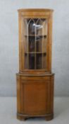 A Georgian style yew wood floor standing corner cabinet. H.181 W.66 D.46 cm