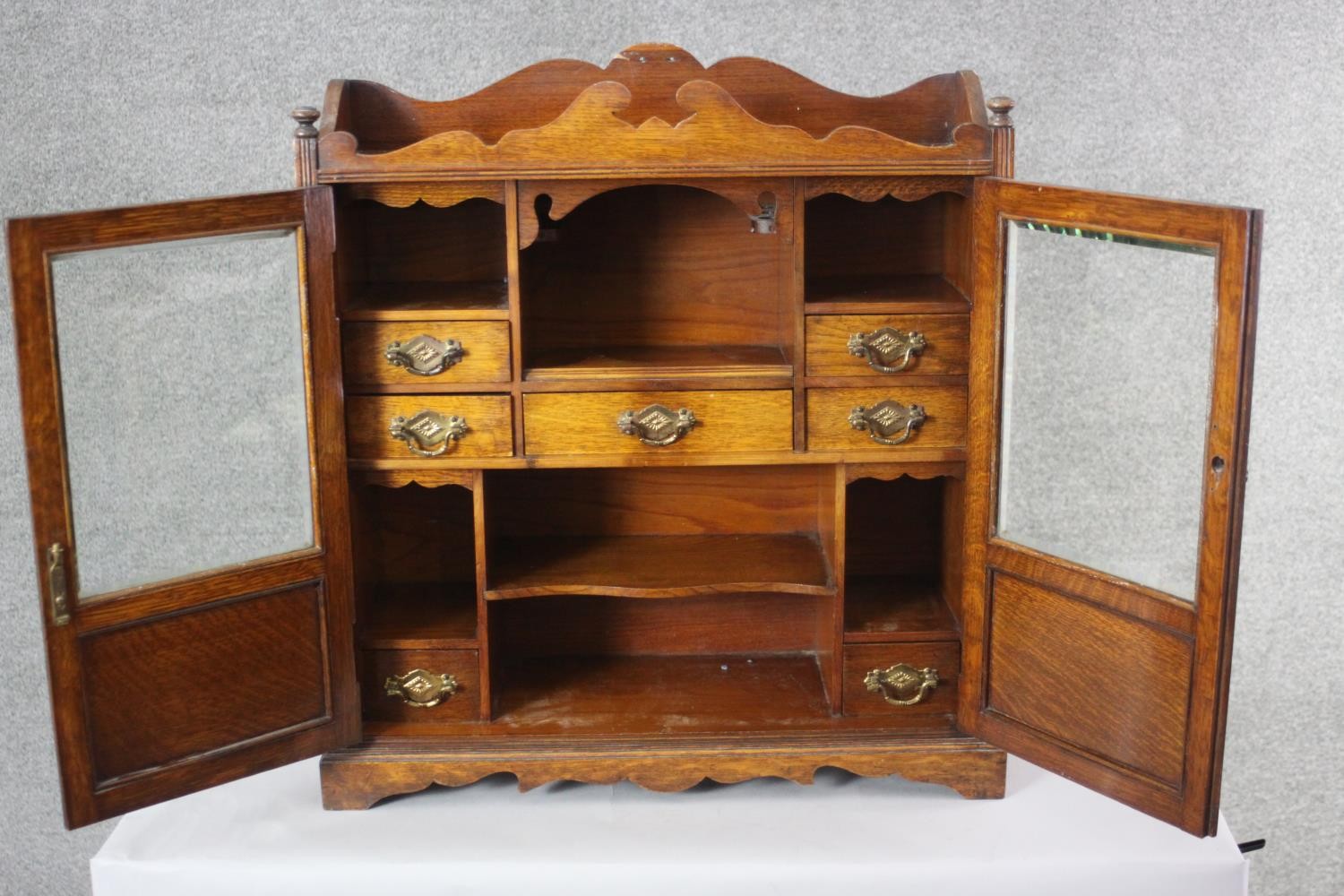 A 19th century oak table cabinet with glazed doors enclosing fitted interior on shaped bracket feet. - Image 4 of 8