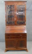 A C.1900 mahogany bureau bookcase the astragal glazed upper section above fall front revealing