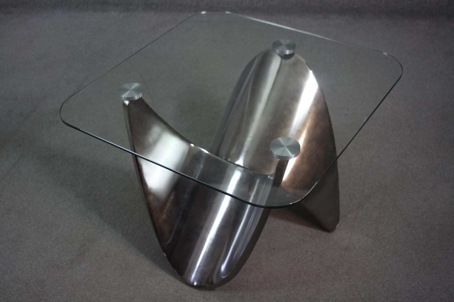 A contemporary occasional table with plate glass top on shaped brushed chromium base. H.55 W.71 D.72 - Image 6 of 7
