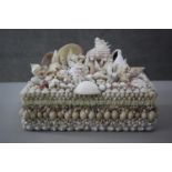 A vintage lined jewellery box encrusted with tropical seashells. H.7 W.29 D.22.cm.