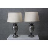 A pair of crackle mirrored grey glass urn design table lamps with cream shades. H.74 Diameter 18 cm.