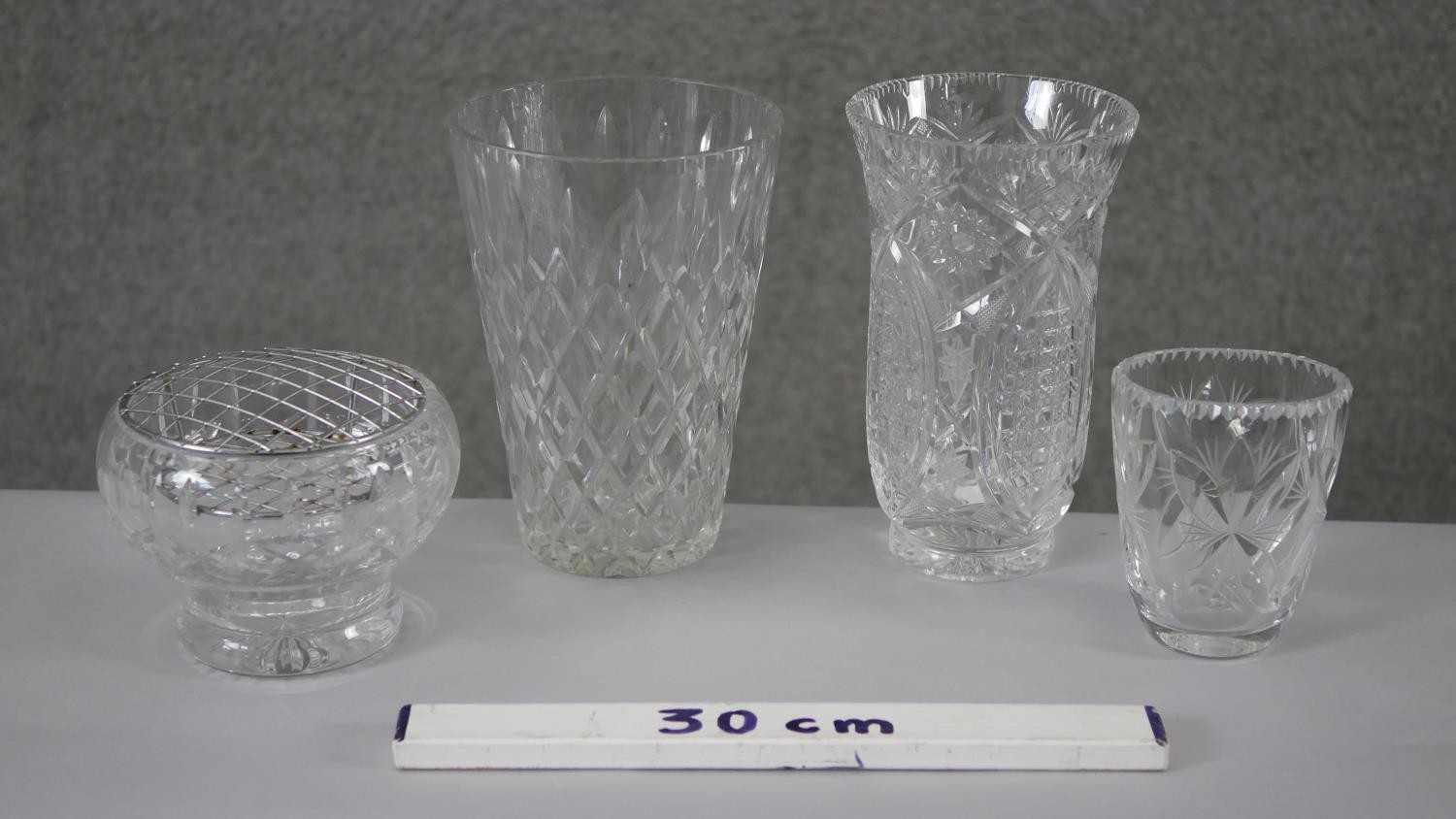 A collection of four cut crystal flower vases with stylised foliate design. H.20 Diam.15cm (largest) - Image 4 of 8