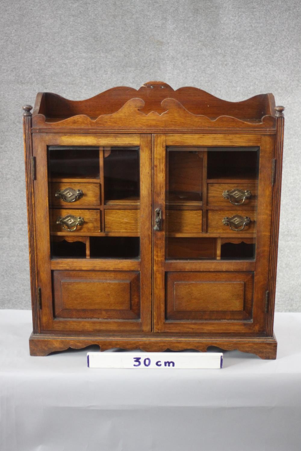 A 19th century oak table cabinet with glazed doors enclosing fitted interior on shaped bracket feet. - Image 8 of 8