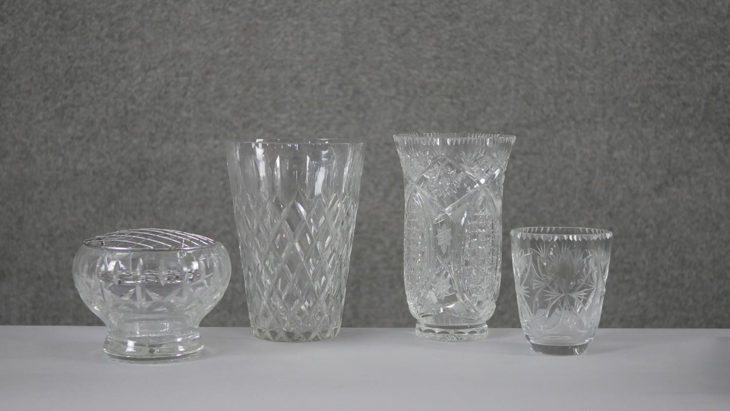 A collection of four cut crystal flower vases with stylised foliate design. H.20 Diam.15cm (largest) - Image 2 of 8