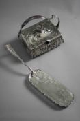 A silver plated handled box with water and koi karp design on four bun feet along with a silver