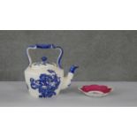 A blue and white Staffordshire ironstone tea pot, rose design along with a hand painted floral