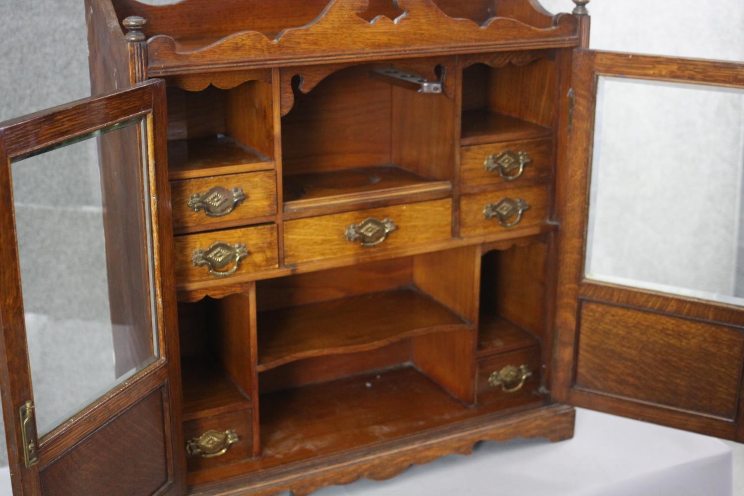 A 19th century oak table cabinet with glazed doors enclosing fitted interior on shaped bracket feet. - Image 5 of 8