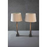 A pair of vintage brass fluted column design table lamps with cream shades. H.54 W.20 D.12cm.