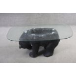 A plate glass topped coffee table with pedestal modelled as a plaster standing bear. H.40 W.70 D.