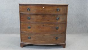 A 19th century mahogany bow fronted chest of drawers on bracket feet. H.101 W.108 D.54 cm