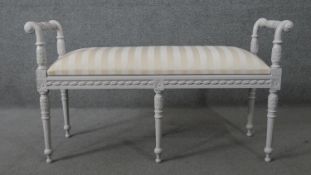 A painted Louis XVI style duet stool with lift up music compartment on fluted tapering supports. H.