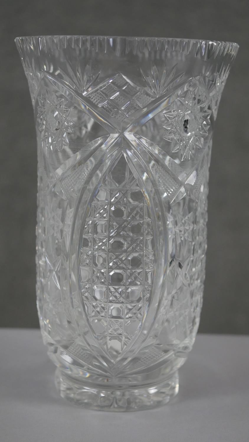 A collection of four cut crystal flower vases with stylised foliate design. H.20 Diam.15cm (largest) - Image 5 of 8