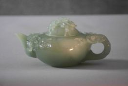 A Chinese 20th century carved jade lidded teapot with cherry blossom detailing and branch form