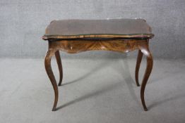 A mid 19th century burr walnut, satinwood and ebony line inlaid card table with fold over top