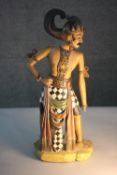 A 20th century west Javanese carved and painted figure of a warrior. H.51 W,20 D.14cm.