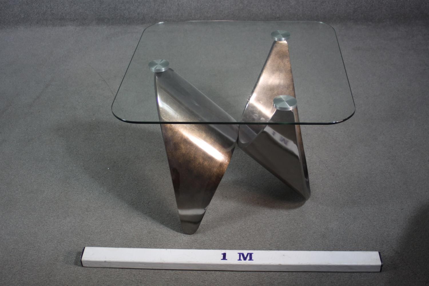 A contemporary occasional table with plate glass top on shaped brushed chromium base. H.55 W.71 D.72 - Image 2 of 7