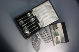A collection of silver and silver plate. Including a cased set of silver coffee spoons, a silver