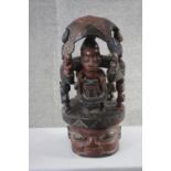 A carved vintage hardwood Cameroonian tribal helmet depicting figures and animals. Top section