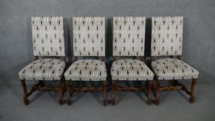 A set of four Continental antique style dining chairs in studded and cut floral upholstery on walnut