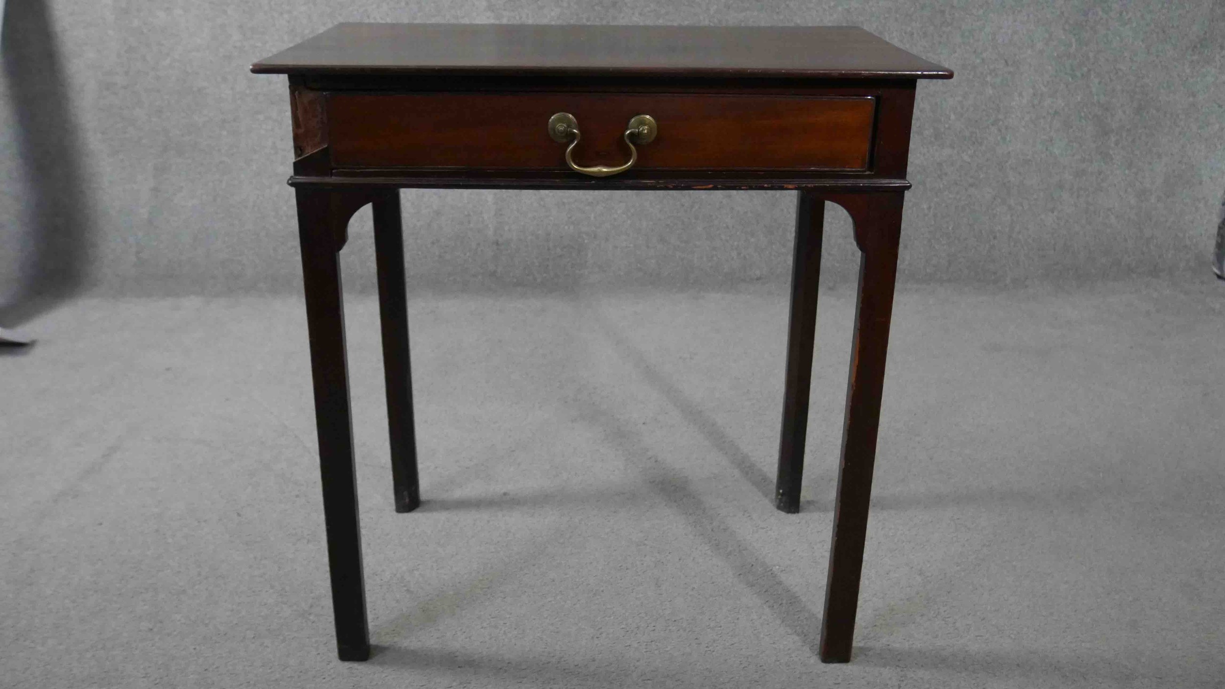 A Georgian mahogany side table fitted with frieze drawer on square tapering supports. H.72 W.50 D.