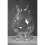 A large contemporary blown clear glass storm lantern with removable base. (2 pieces) H.46 Diameter.