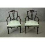 A pair of mahogany Hepplewhite style open armchairs with shaped pierced splats above stuffover seats