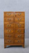 A Chinese hardwood chest of drawers fitted with central slide on shaped bracket feet. H.104 W.60 D.