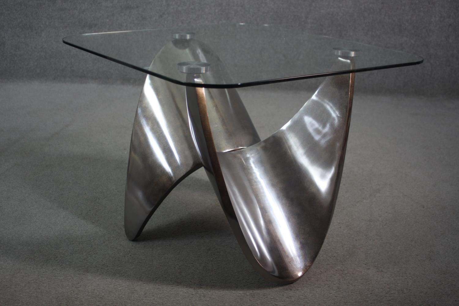 A contemporary occasional table with plate glass top on shaped brushed chromium base. H.55 W.71 D.72 - Image 3 of 7
