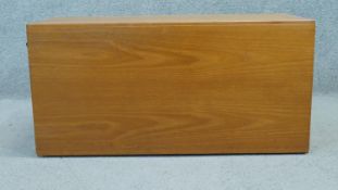 A vintage teak wall mounted cabinet. H.40 W.84 D.40cm (Originally wired with internal light).