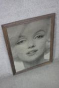 A framed mirrored panel with black and white transfer print of Marilyn Monroe. H.70 W.52cm.