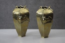 A pair of Meji period Japanese brass bat vases. The vases with a six-sided, tapered design with