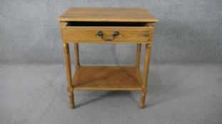 A French Provincial style oak side table on fluted tapering supports. H.75 W.65 D.45CM
