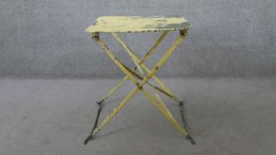 A vintage painted metal folding garden table. H.65 W.58 D.58cm