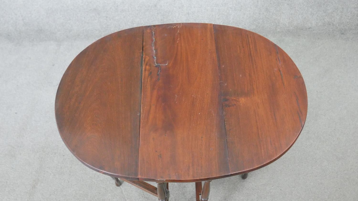 A vintage teak drop flap table on turned stretchered gateleg supports. H.62 W.60 D.45CM - Image 3 of 5