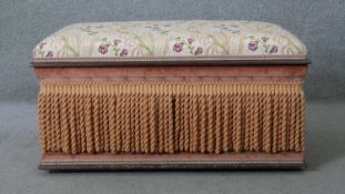 A floral upholstered ottoman with lined interior. H.46 W.94 D.53CM