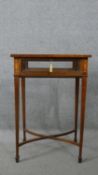 A late 19th century mahogany vitrine with satinwood foliate scrolling and urn motif inlay raised