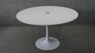 A vintage Eero Saarinen design 'Tulip' dining table and a matching set of five vintage tub swivel