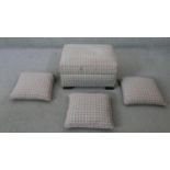 A contemporary upholstered footstool with matching cushions. H.33 W.64 D.50CM (largest)