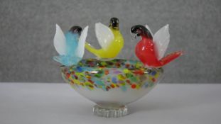 A Murano polychrome swirl glass bird bath bowl with three prime coloured birds perched on the rim.