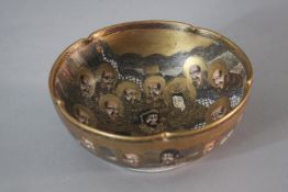 A Meji period hand painted and gilded satsuma bowl with scalloped edge and decorated with twelve
