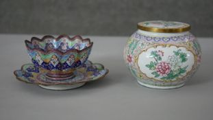 A Canton enamel floral design lidded box along with an Oriental Minikari enamel tea bowl and saucer.